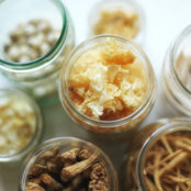 jars full of roots, stems, and leaves that are used in herbal medicine